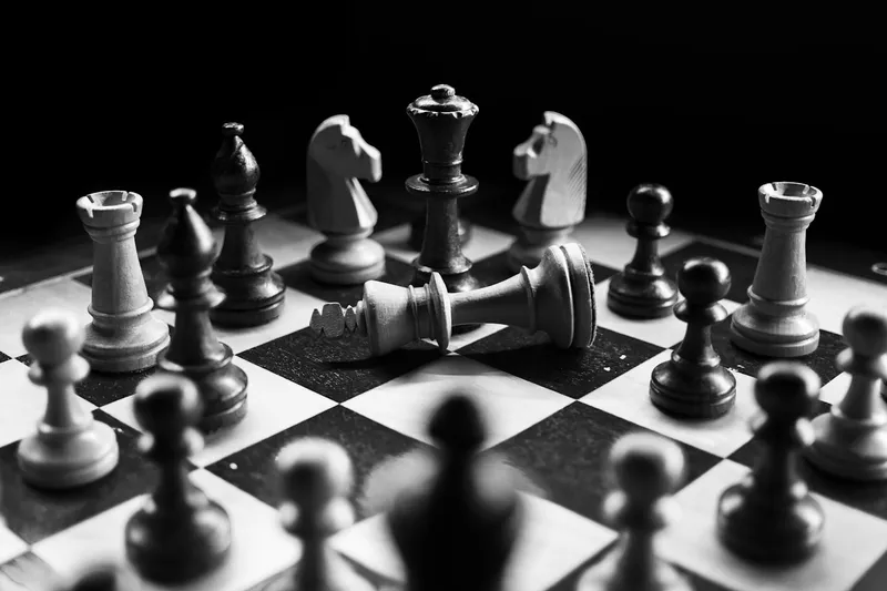 Chess pieces on a board mid-game
