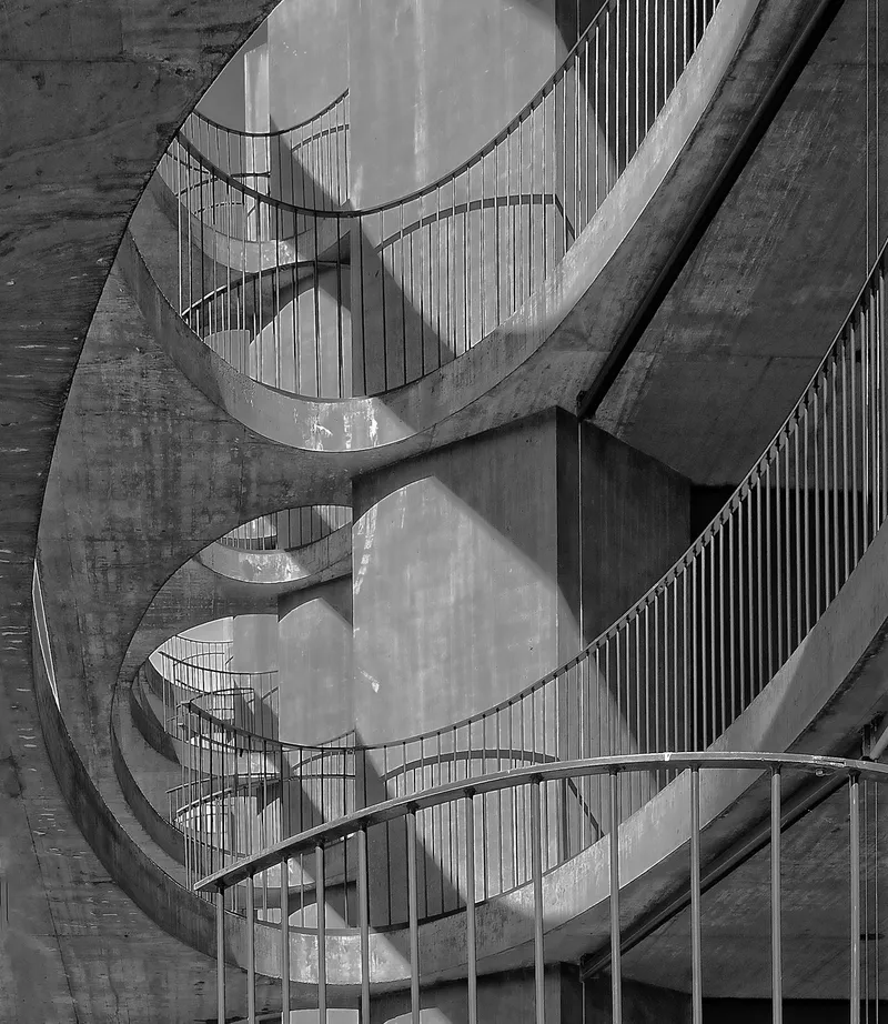 Curved concrete balconies stacked above one another